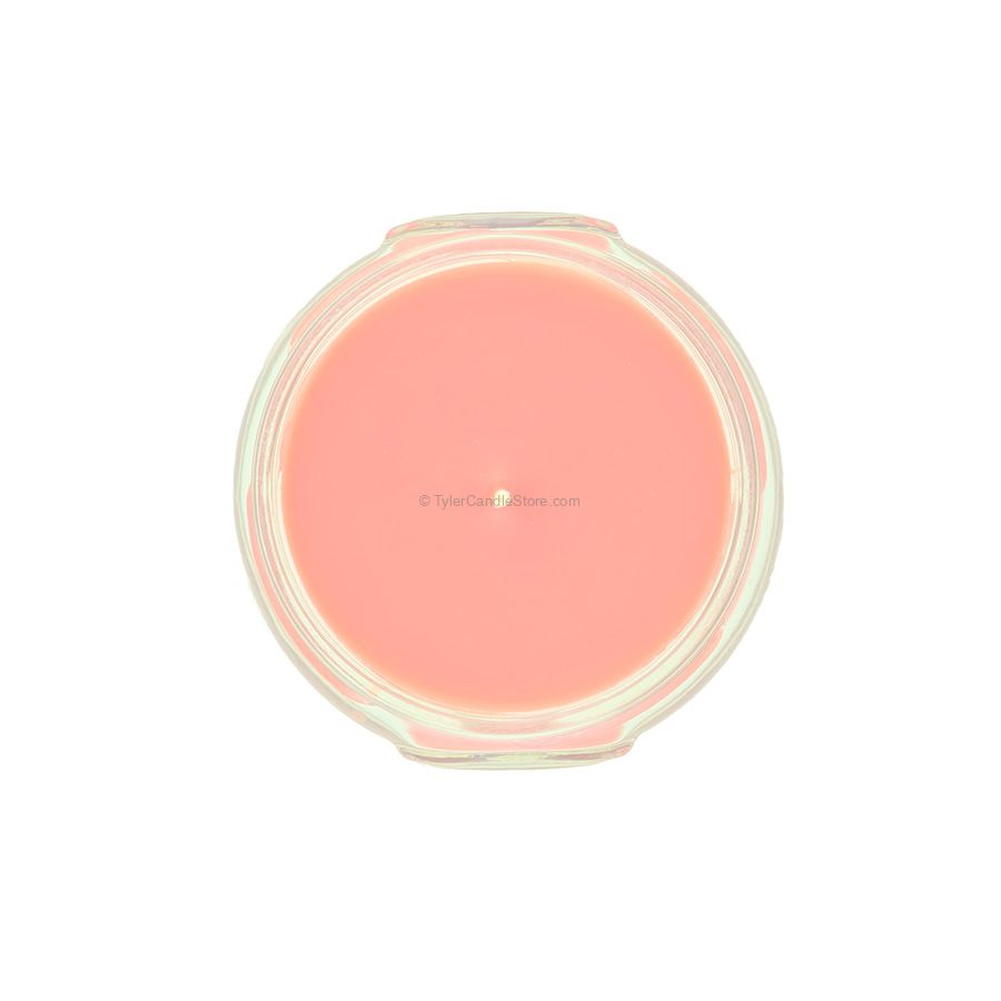Top-down view of a 3.4oz pink candle in a clear glass jar.