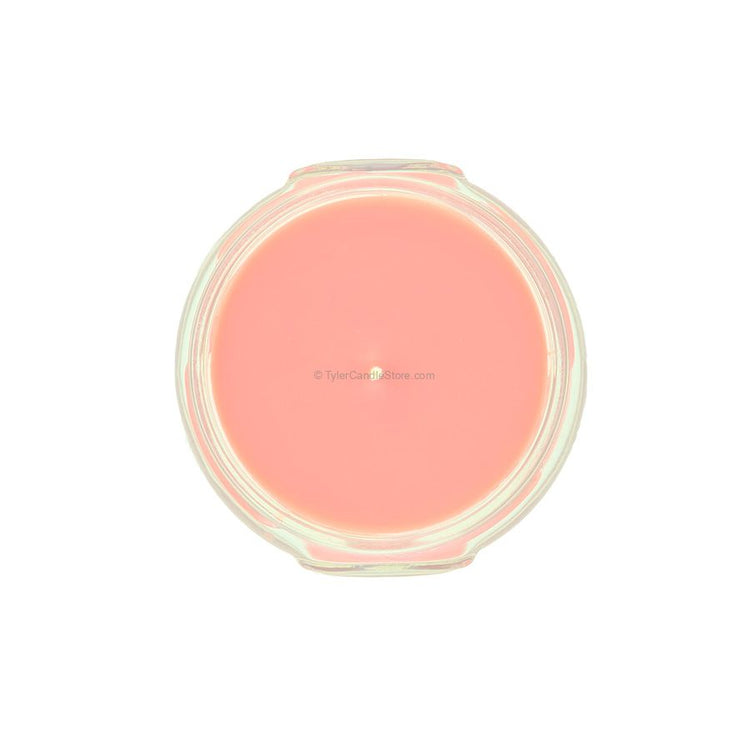 Top-down view of a 3.4oz pink candle in a clear glass jar.