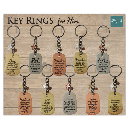 Silver metallic rectangular key ring with engraved Philippians verse on a dark background.