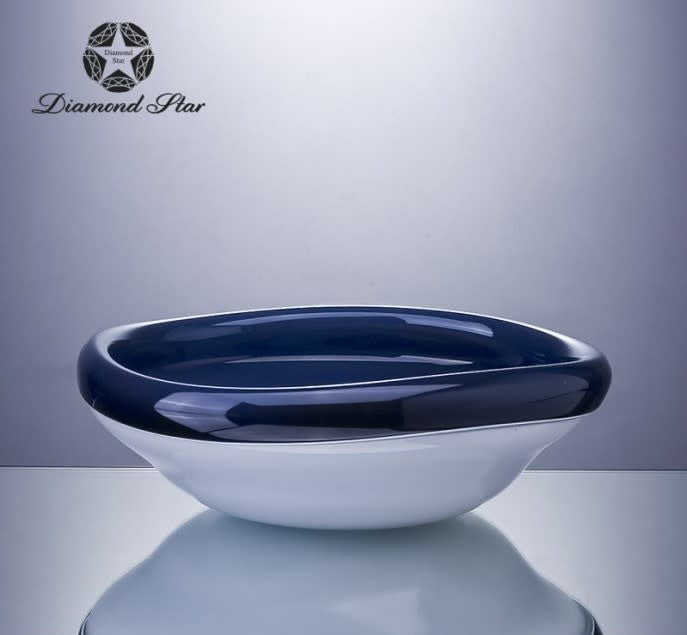 Clear glass decorative bowl with a sleek circular shape.
