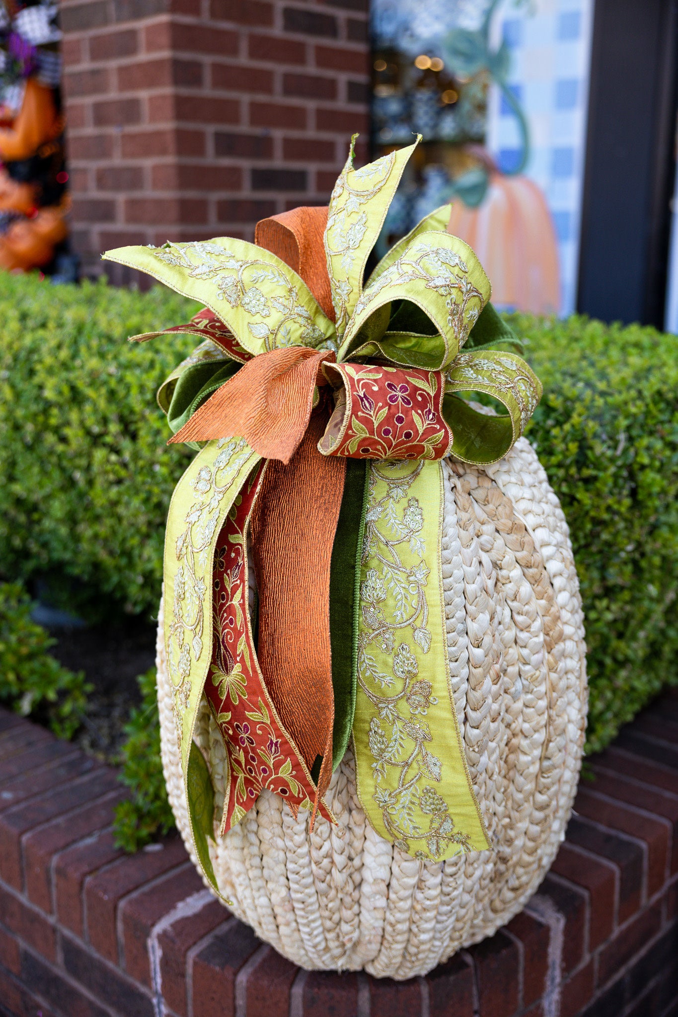 Large cream ribbon bow with gold center accent