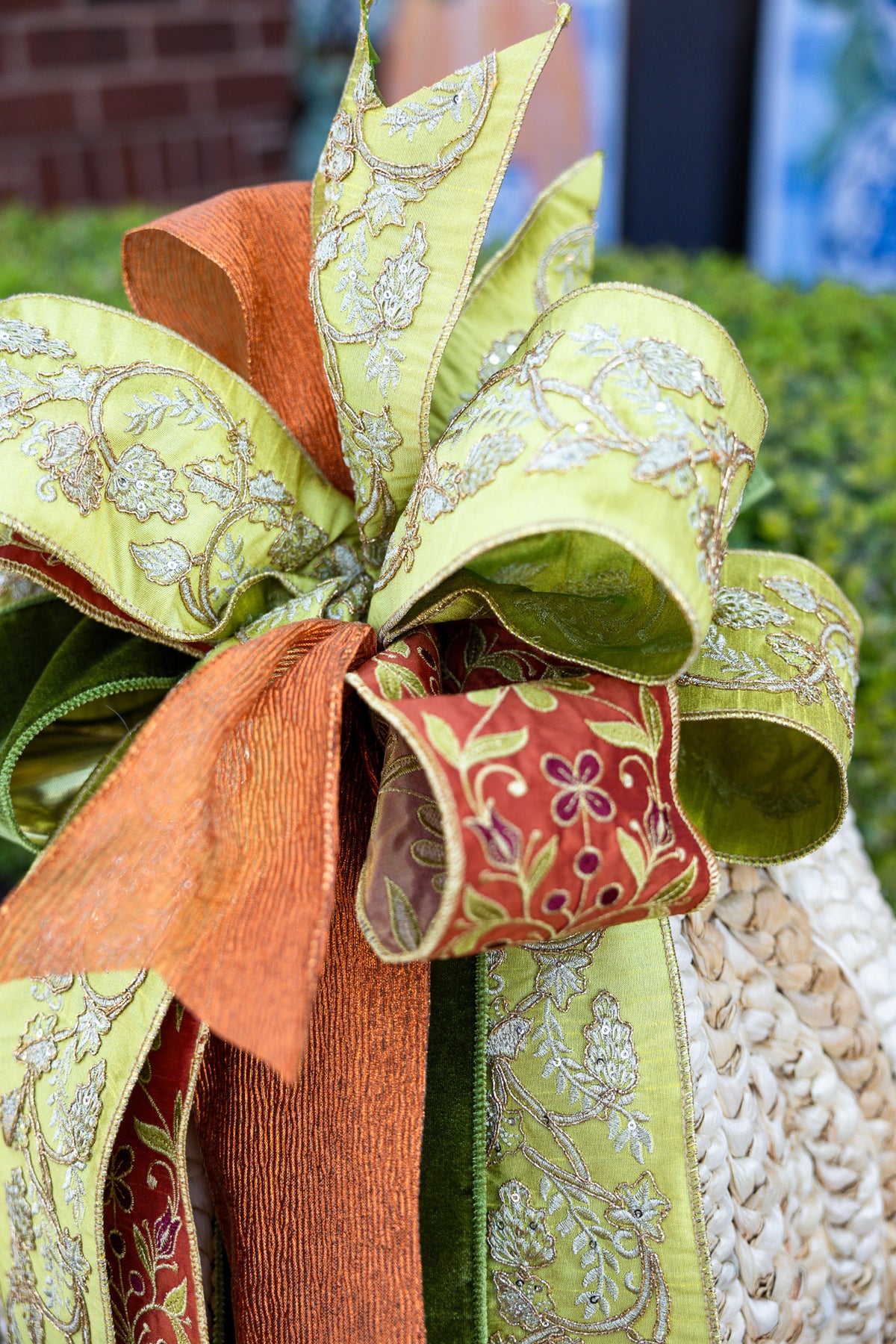 Large cream ribbon bow with a soft gathered center knot.