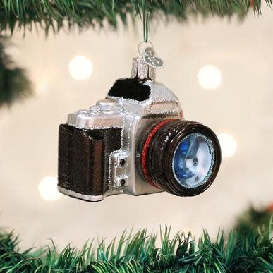 Red glossy camera-shaped ornament with silver lens detail