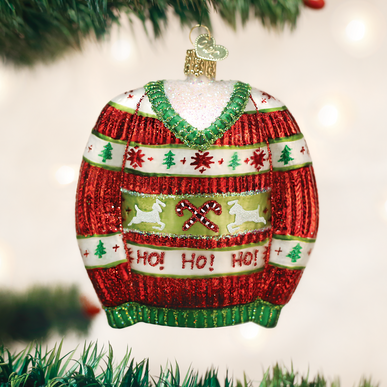 Red Christmas sweater ornament with white snowflake print.