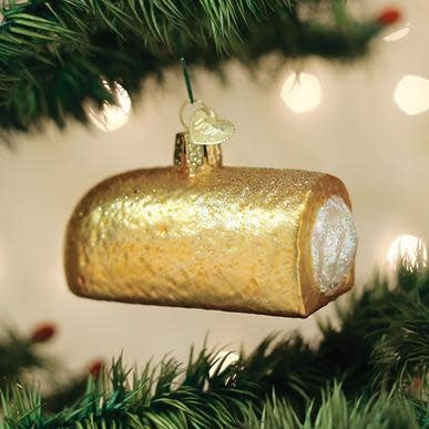 Hostess Twinkie holiday ornament with golden cake texture on white background