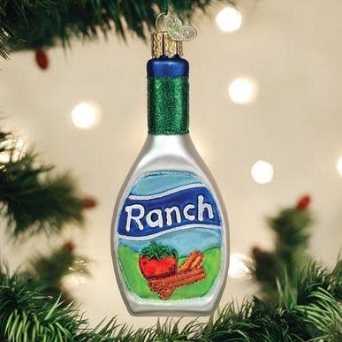 Mouth-blown glass ornament shaped like a ranch dressing bottle with silver accents.