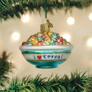 White ceramic bowl ornament filled with colorful cereal pieces.