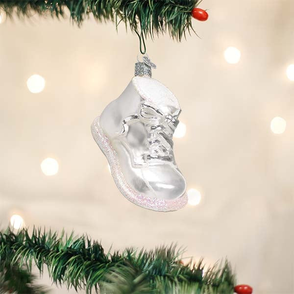 White baby shoe ornament with a classic loafer silhouette.