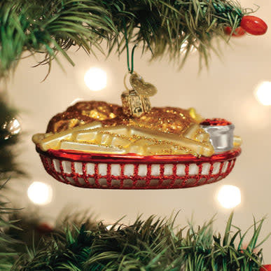 Ceramic chicken basket ornament with fried chicken and fries in a yellow-orange hue.