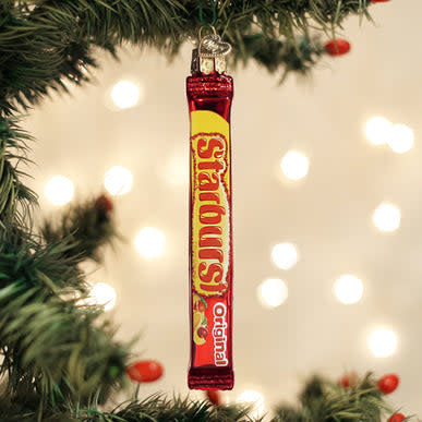 Red Starburst candy ornament with glossy finish shaped like a wrapped sweet.