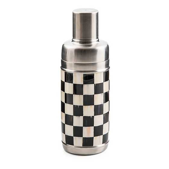 Stainless steel cocktail shaker with a black and white checkered enamel pattern.