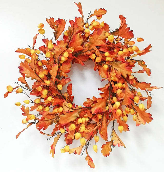 Oak leaf wreath with lantern accent in warm brown tones