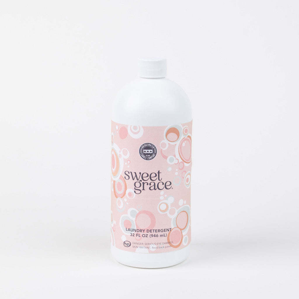 32oz bottle of Sweet Grace laundry detergent with a white cap and pink bubble-patterned label.