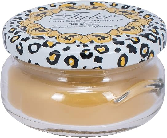 3.4oz Tyler Candle in a glass jar with a leopard print lid.