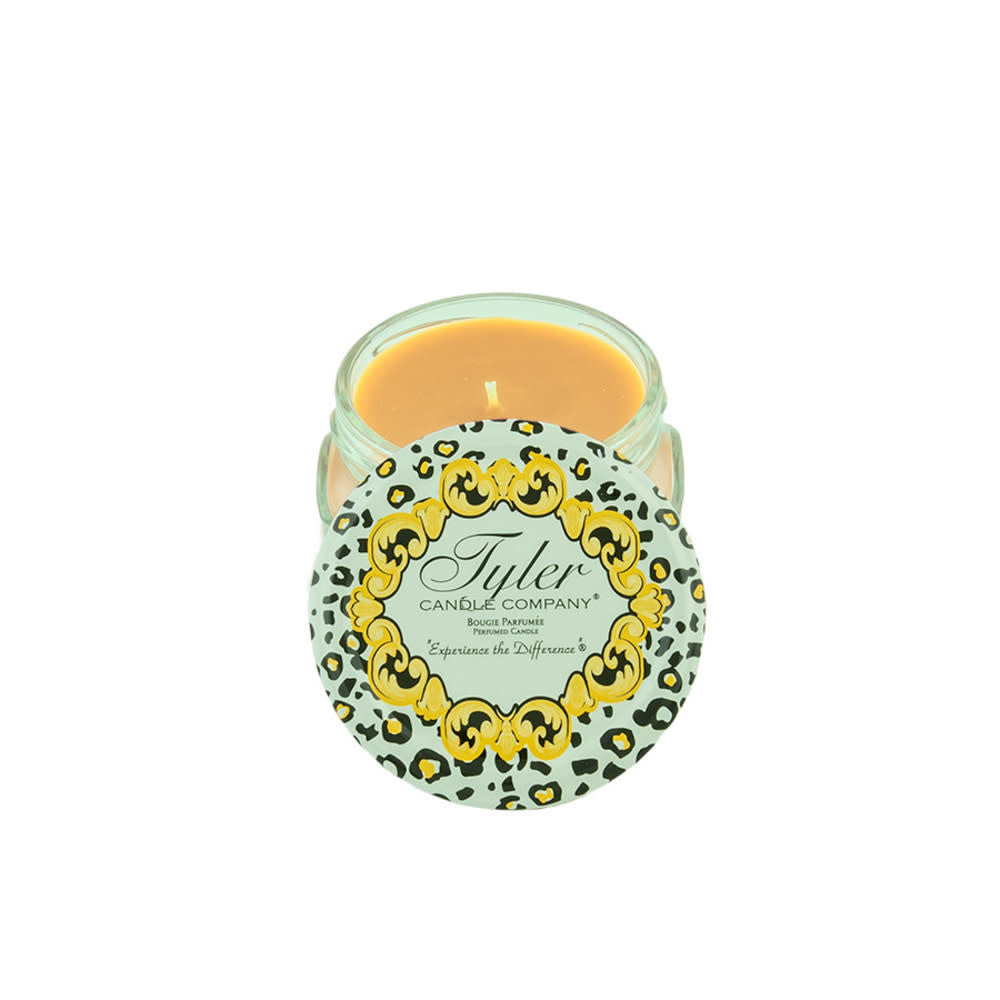 3.4oz Tyler Candle in a glass jar with a leopard print lid featuring a gold ornate border.