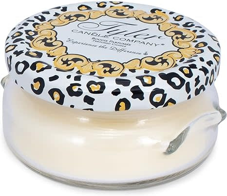 3.4oz Tyler Candle in a glass jar with a white and gold leopard print lid.
