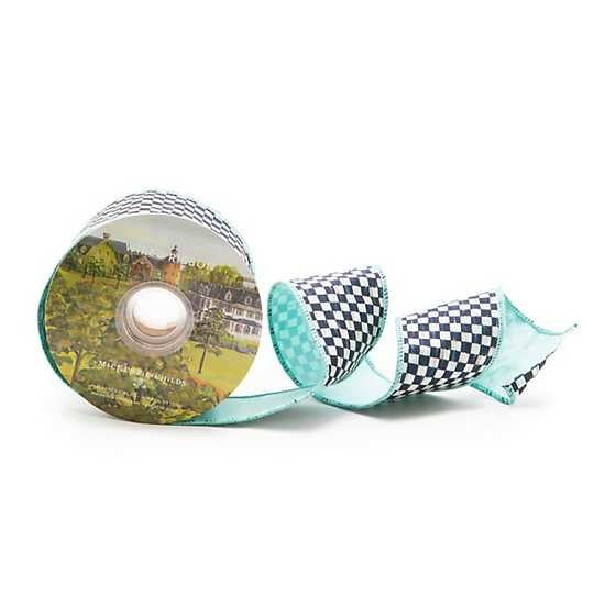 A roll of 2.5-inch wide aqua and black checkered ribbon with a linen finish and wired edges.