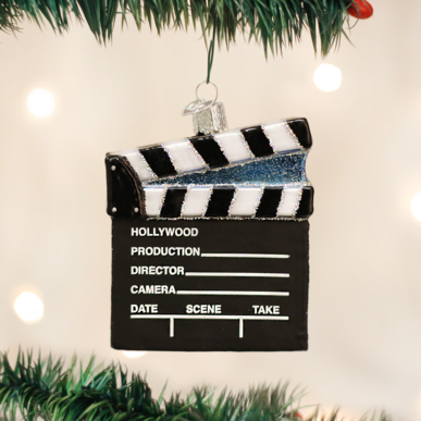 Wooden director's clapboard ornament with diagonal stripes.