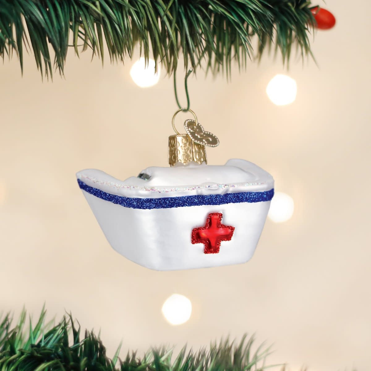 White fabric nurse's cap ornament with a classic rounded shape.