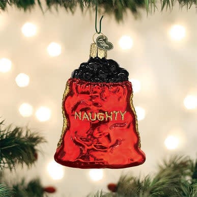 Black coal bag Christmas ornament with Santa Claus illustration on white background