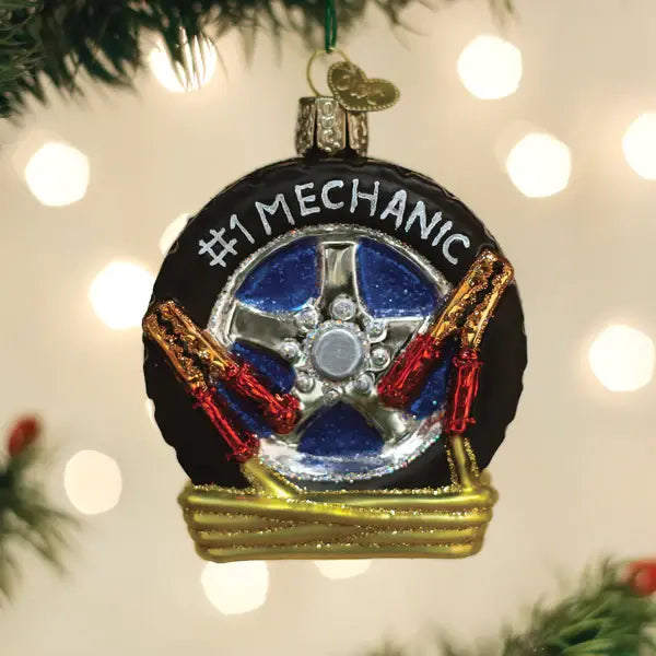 Auto Mechanic ornament featuring a stylized mechanic figure in blue overalls holding tools against a white background.