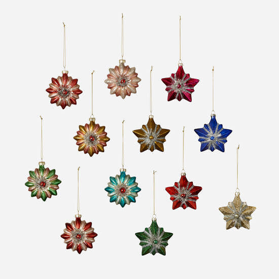 A collection of 3.75-inch glass starburst ornaments with tinsel centers in various festive colors.