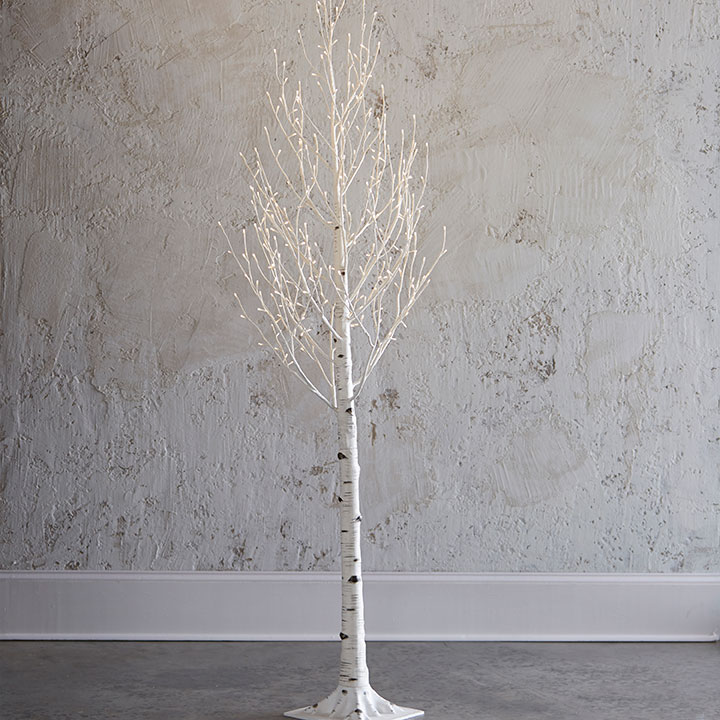 White plastic birch tree with white branches featuring steady warm white LED lights.