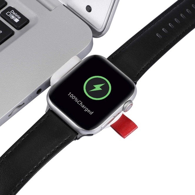 Compact portable Apple Watch charger with USB connection in black casing.
