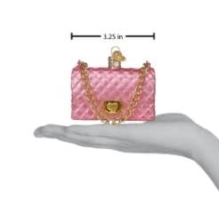 Quilted purse ornament in a structured rectangular shape with visible stitching texture.