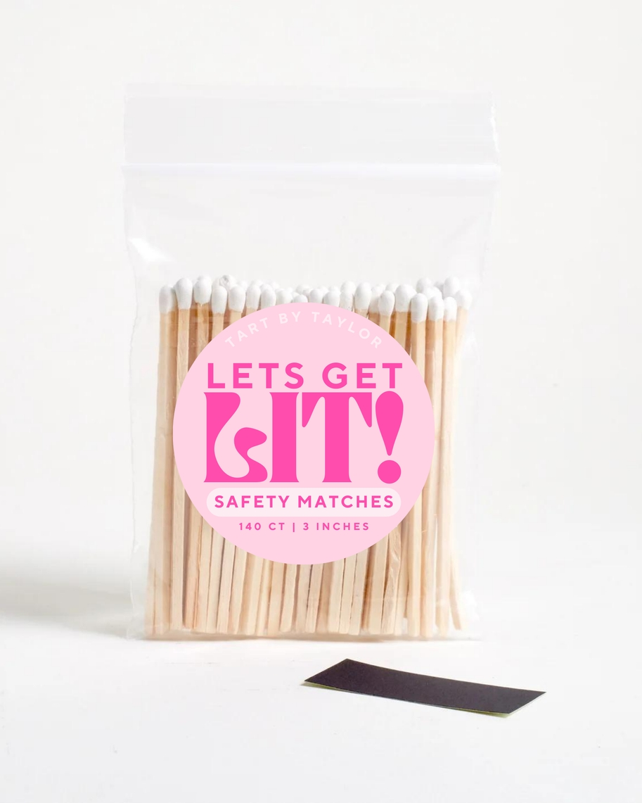 A clear bag of 140 white-tipped 3-inch safety matches with a pink 'Lets Get Lit' sticker.