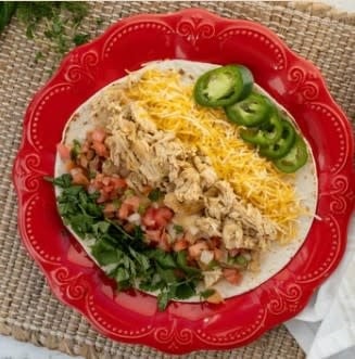 Santa Fe Chicken casserole skillet with chicken, pasta, black beans, melted cheese, and sour cream.