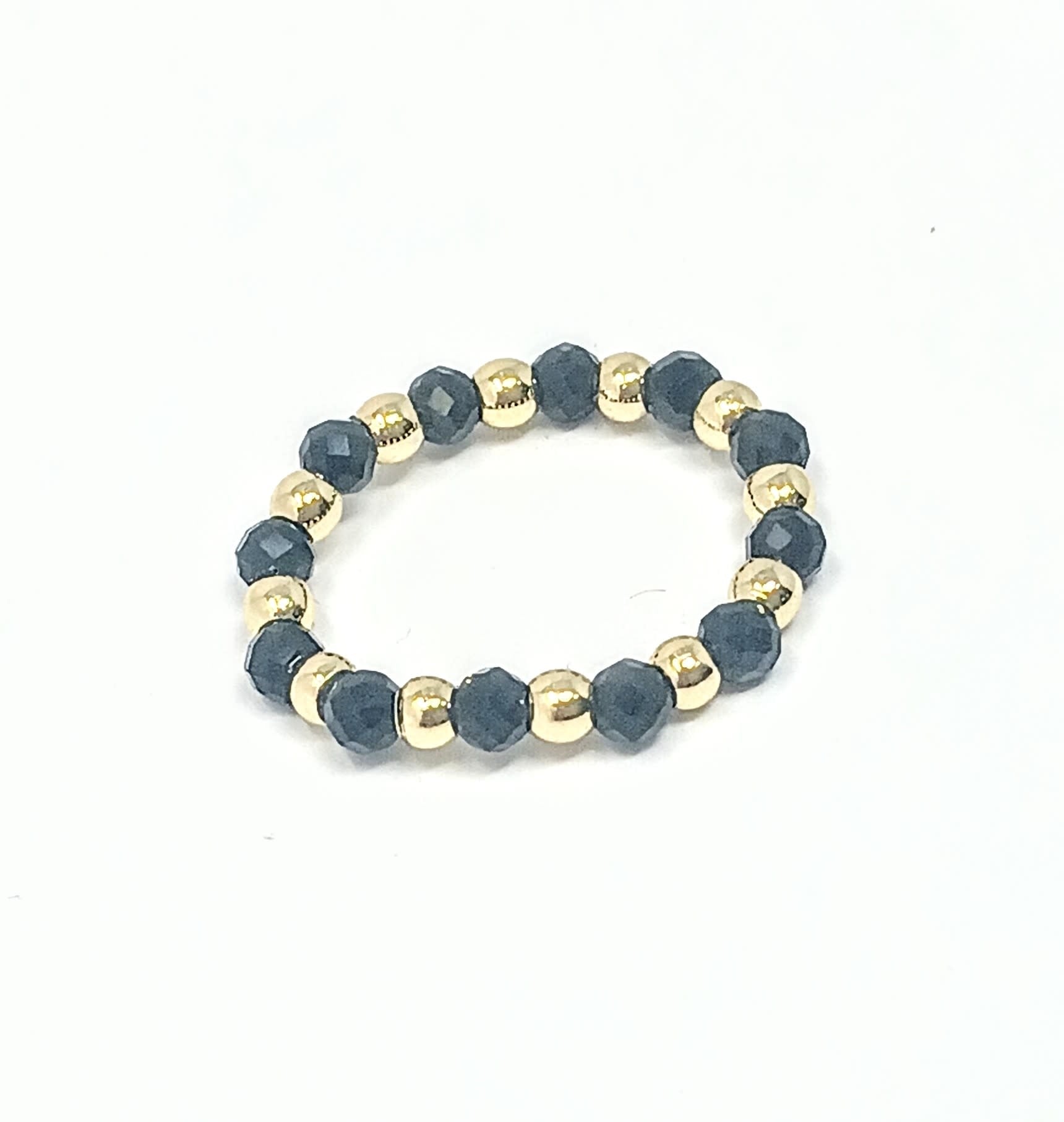 Beaded ring featuring alternating 3mm gold-tone spheres and dark faceted semi-precious stones.