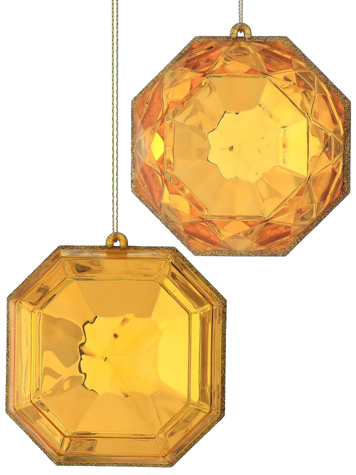 Two 4-inch gold acrylic precious gem ornaments with faceted surfaces and glittered edges.