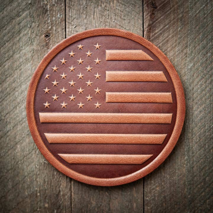 Square American flag leather coaster with red white stripes and blue field featuring stars.