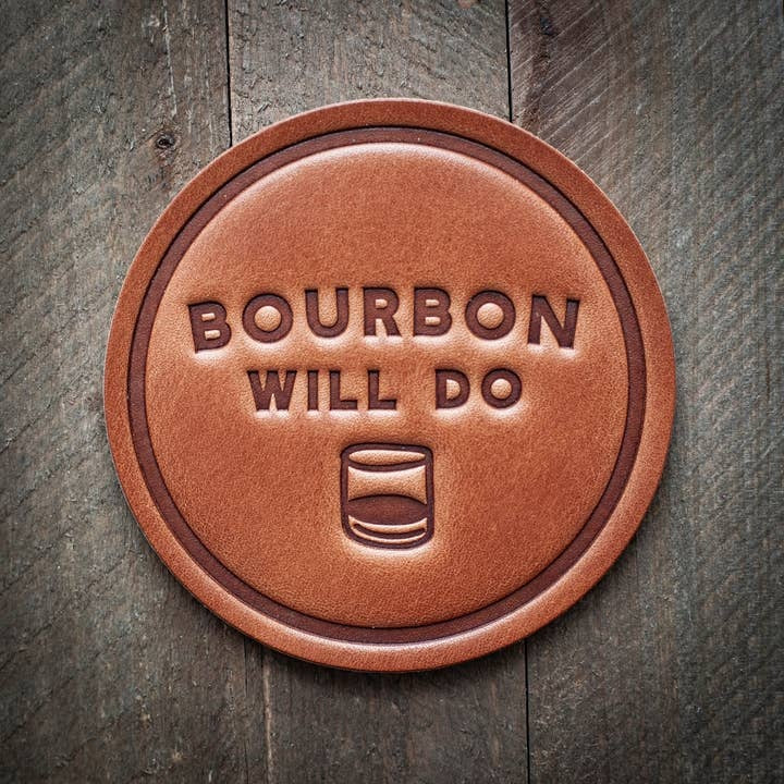 Square leather coaster in bourbon brown with a subtle texture.