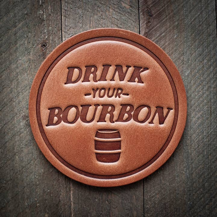 Square brown leather coaster with a subtle texture designed to protect surfaces from drink condensation.