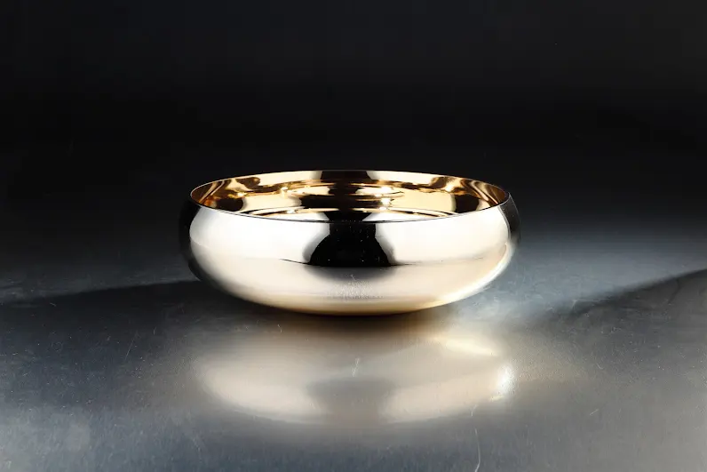 Mercury glass bowl with vintage finish, circular shape, suitable for home decor.