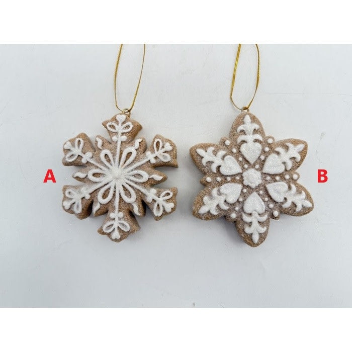 Resin gingerbread snowflake ornament with white icing patterns on a dark brown cookie-shaped silhouette.