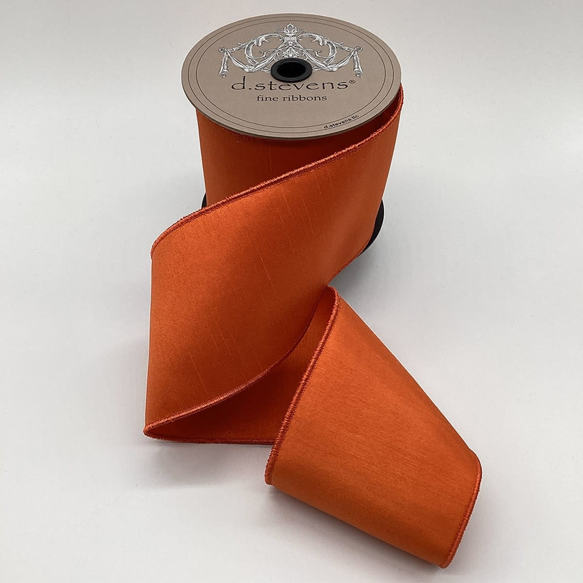 4-inch by 10-yard roll of orange faux dupion fabric with a smooth texture.