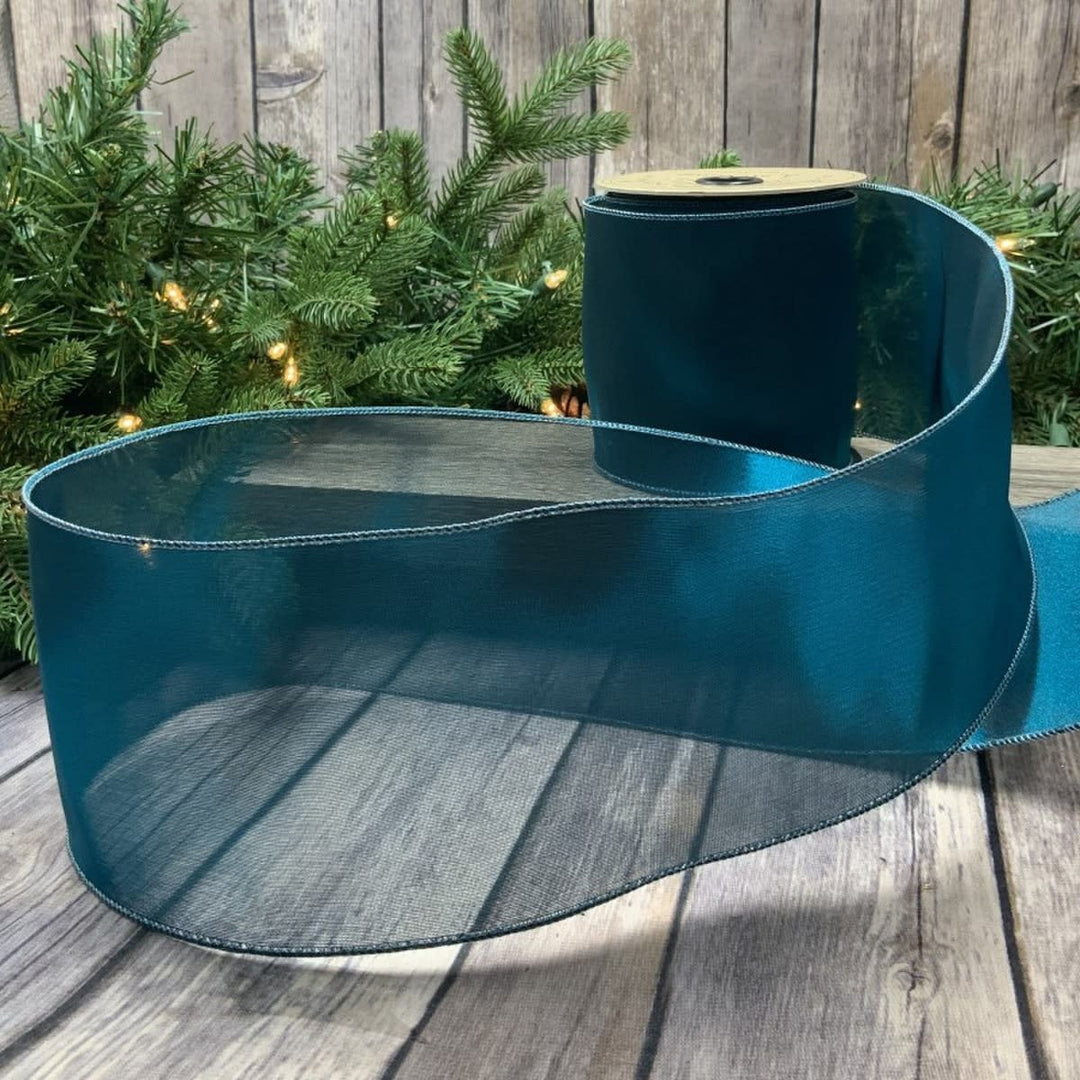 4-inch wide by 10-yard roll of metallic tissue silk in peacock blue with shimmering iridescent finish.