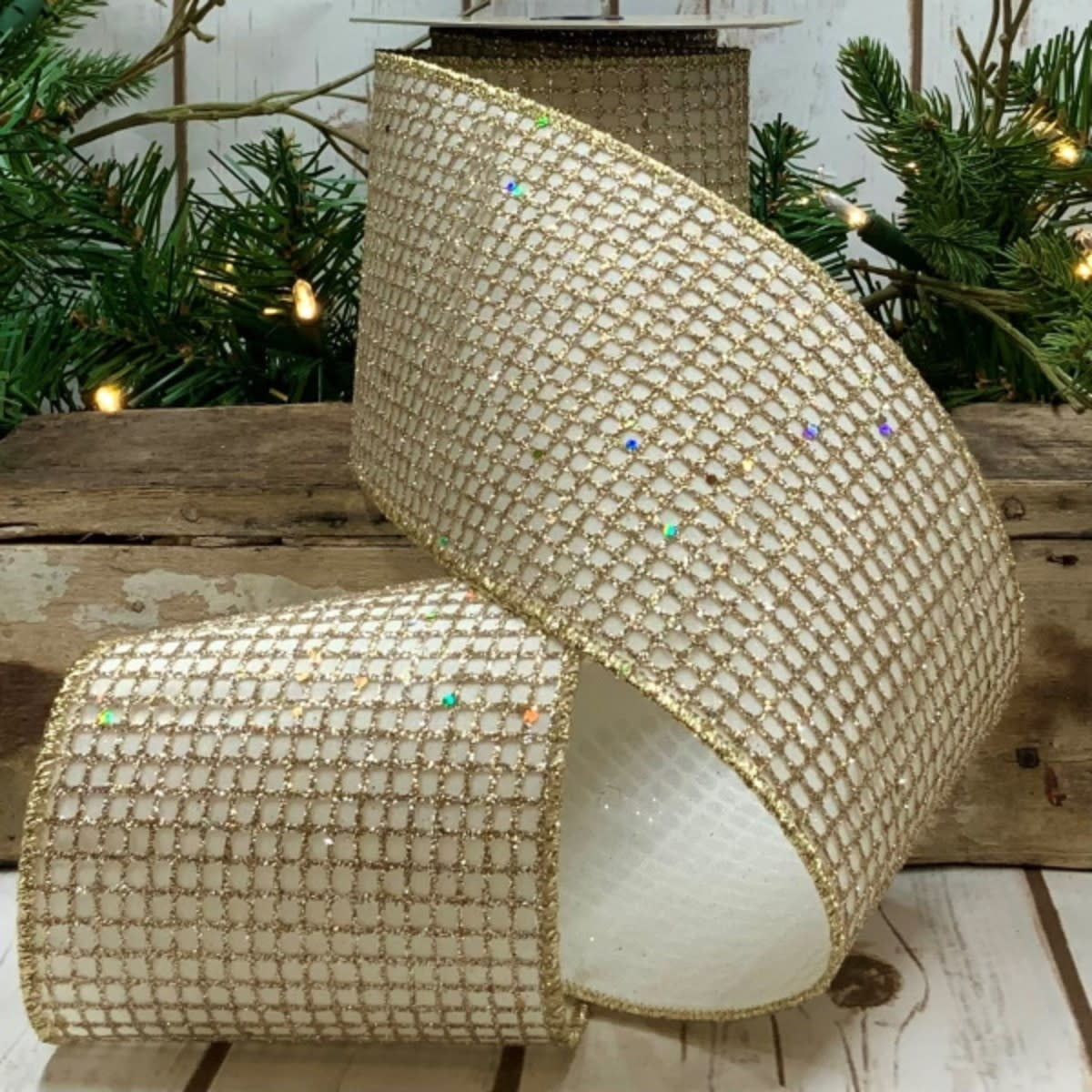 Ten yards of platinum glitter taffeta mesh ribbon with an ivory base.