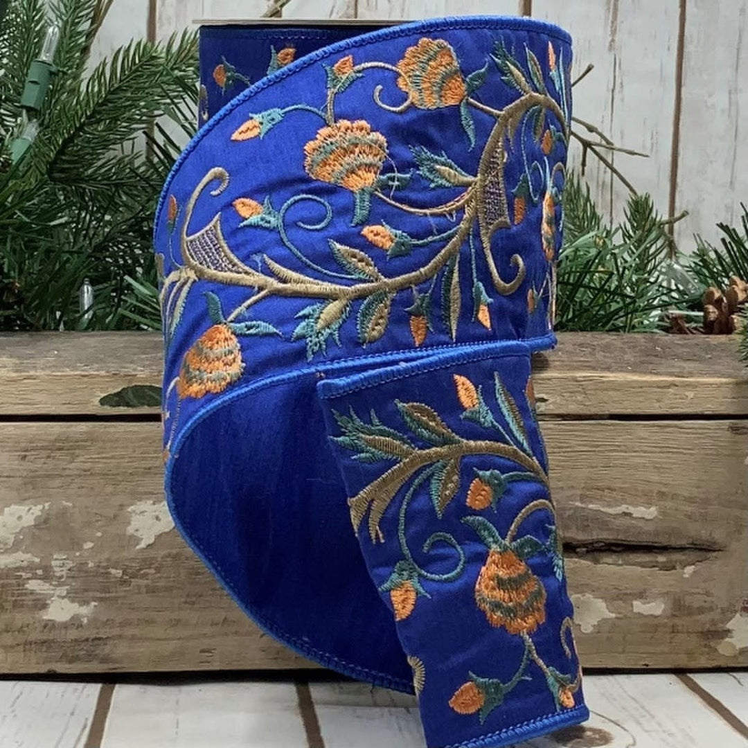 4-inch wide orange faux dupion ribbon with blue floral embroidery pattern