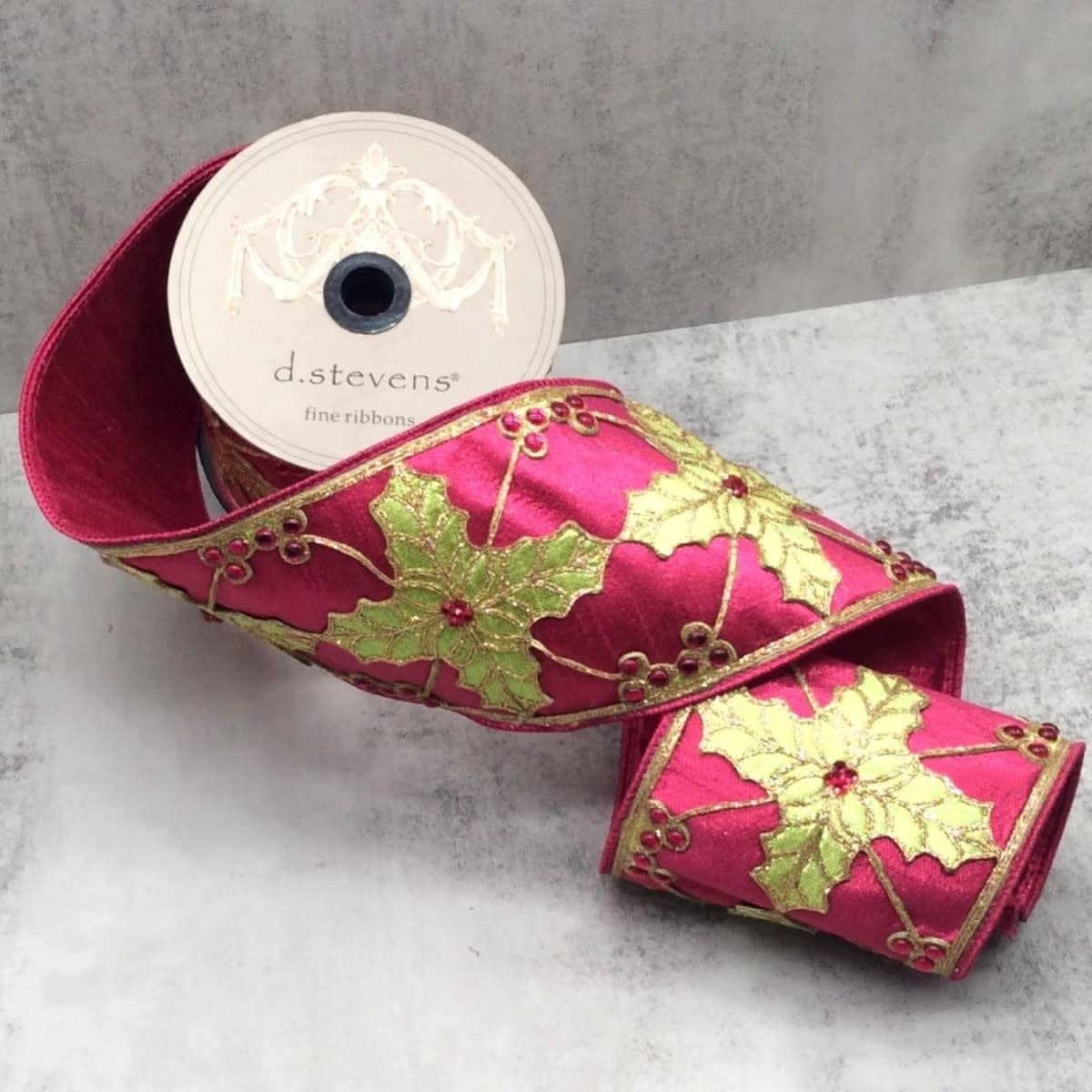 Metallic Dupion fabric cutout featuring a holly leaf pattern with jewel accents in red and green.