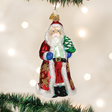 Glistening golden Santa Claus ornament with a shiny metallic finish.