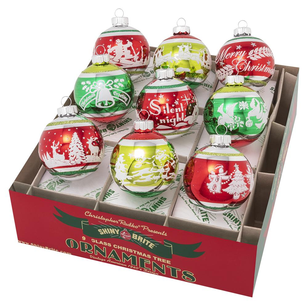 Red frosted glass Christmas ornament with green flocked finish featuring classic holiday patterns on a round silhouette.