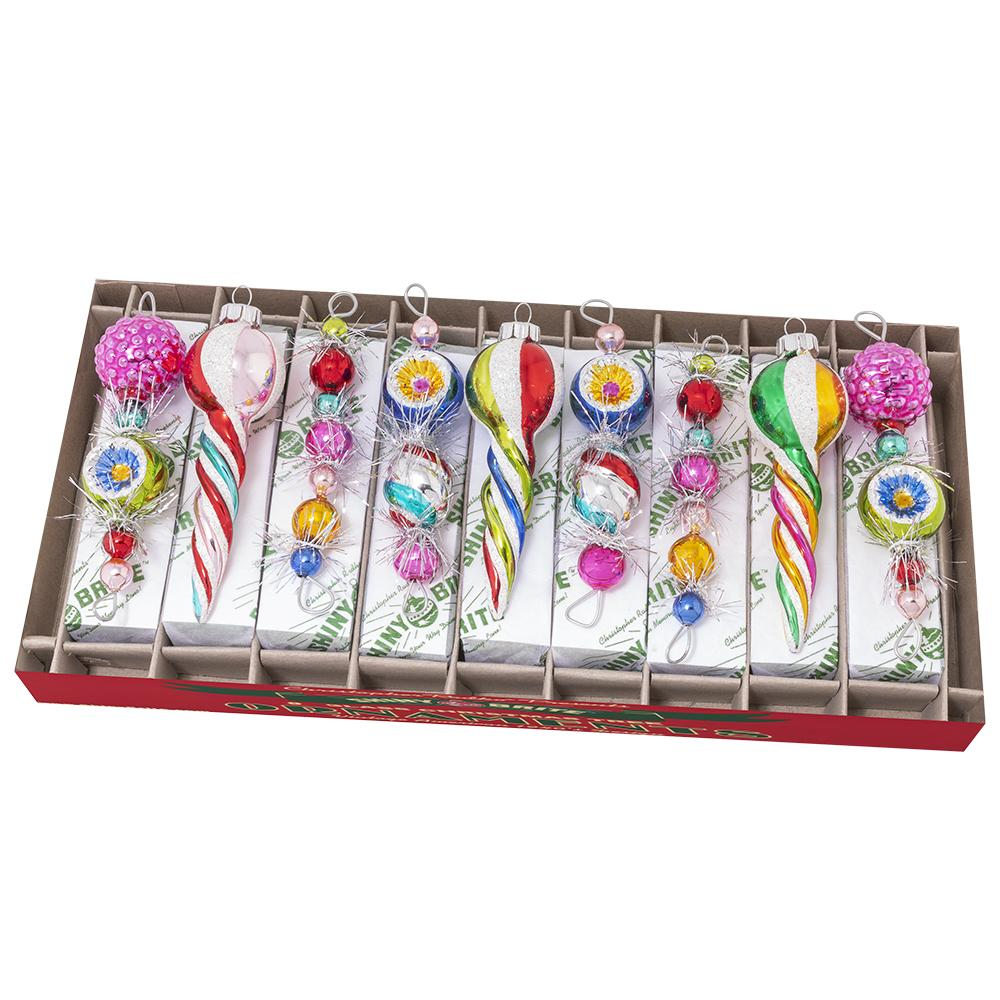 Nine vintage-style Christmas icicle ornaments in classic holiday hues with sparkling silver tinsel accents.