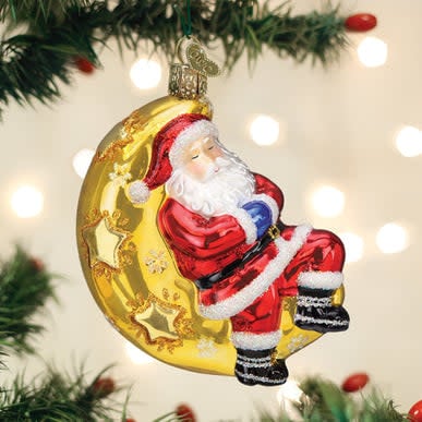 Moonlight Santa ornament showing a sleeping figure in a sleigh on the moon surface.