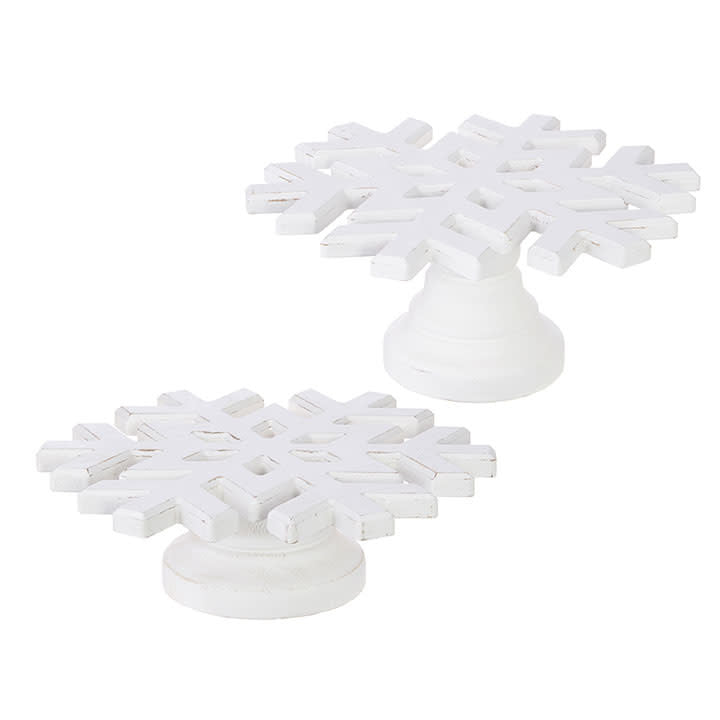 White wooden snowflake-shaped pedestal riser measuring 12 inches deep by 5.5 inches high.