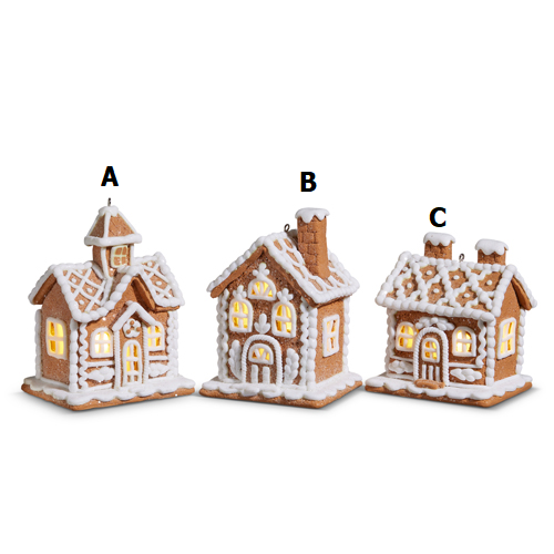 Lighted gingerbread house ornament made of clay dough with a warm glow inside.
