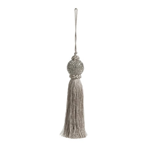 Eight-inch silver tassel ornament made of polyester, plastic, glass, and brass with a classic design.